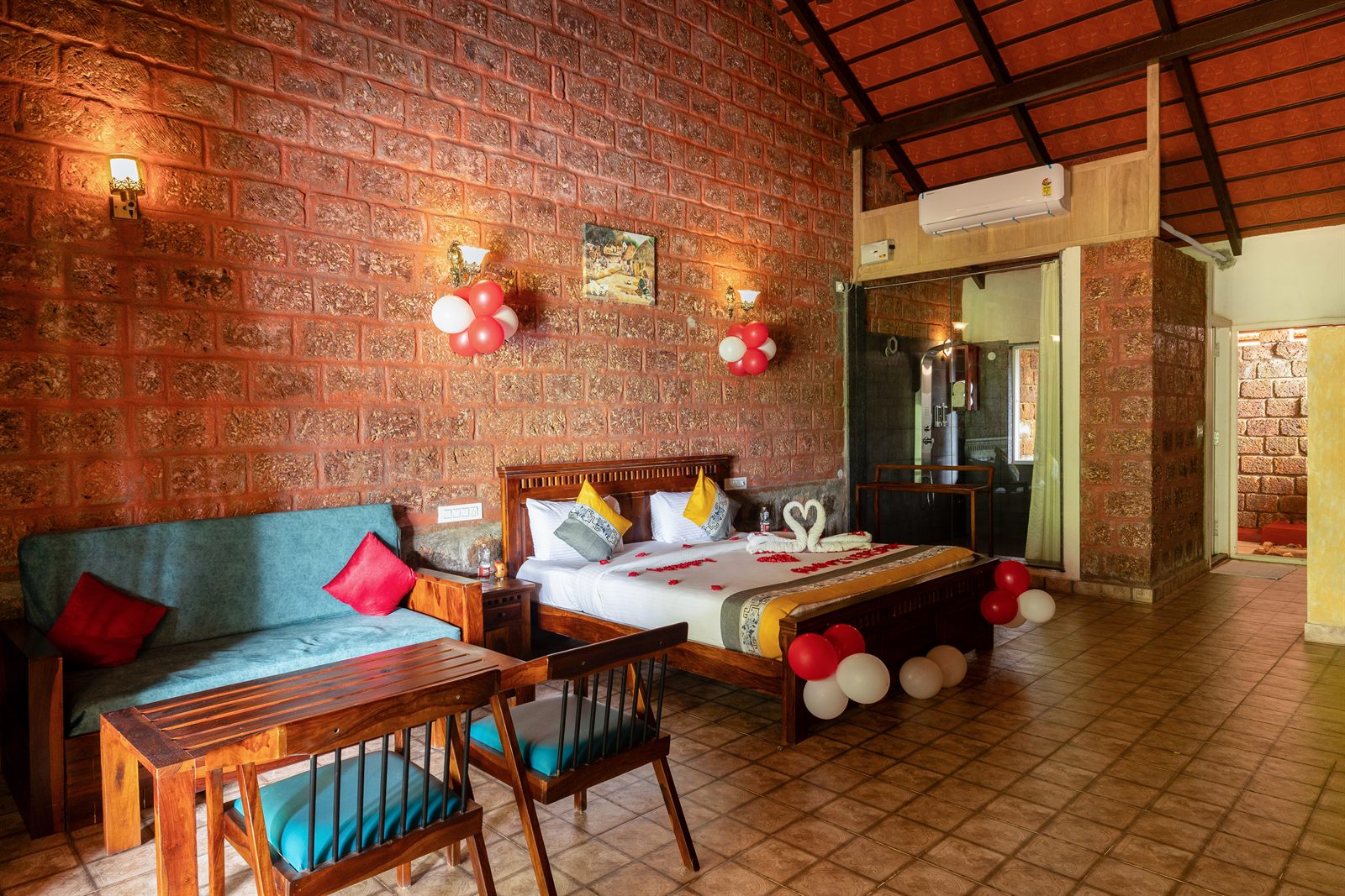 Bedroom set up with balloon decoration at Adhalakki Gudlu Cottage